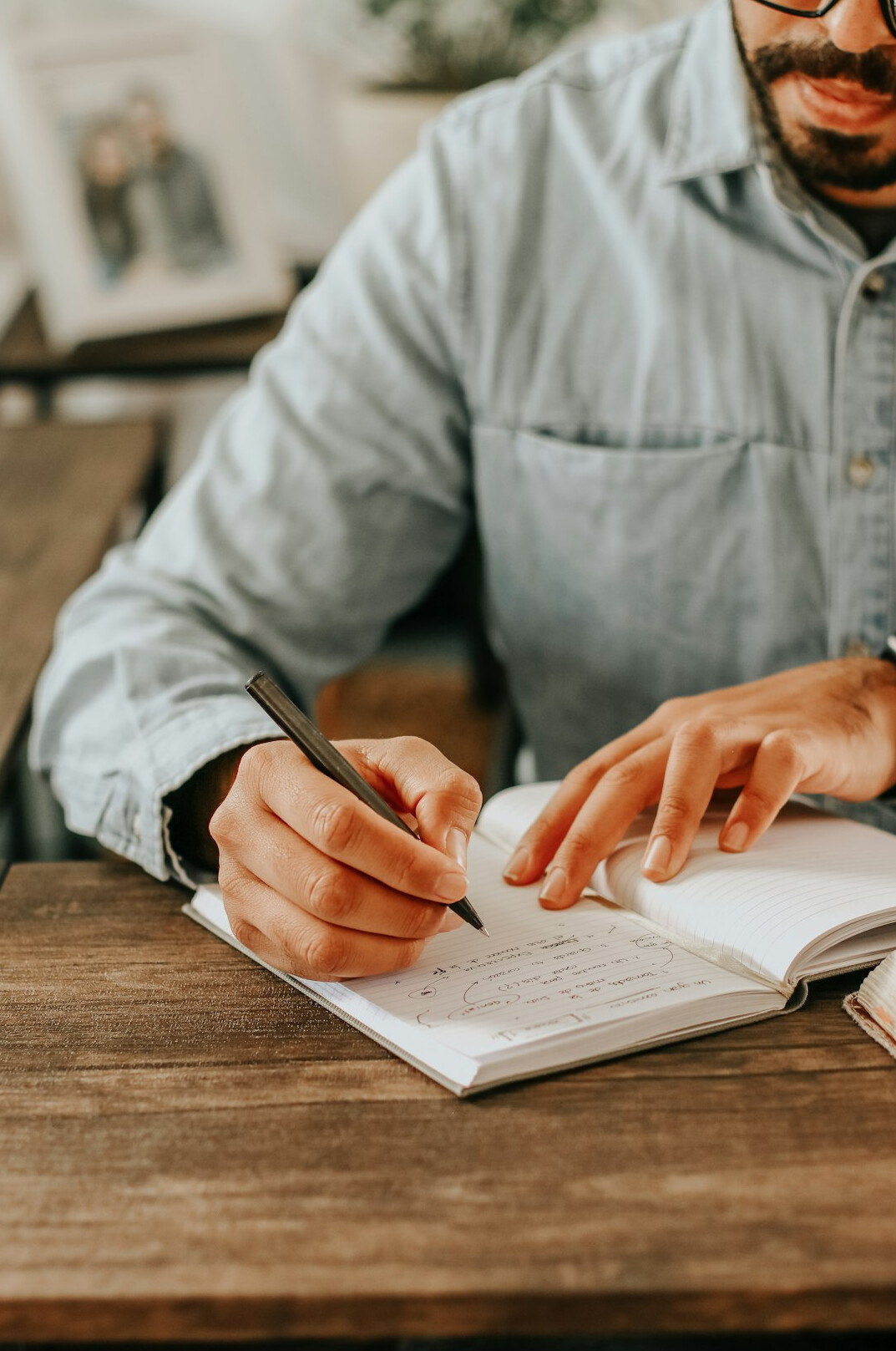 person planning day with notebook