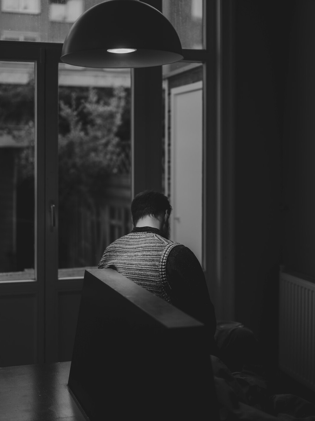 man meditating in quiet room